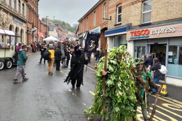 Green Man in leaves parading through streets of Bovey Tracey